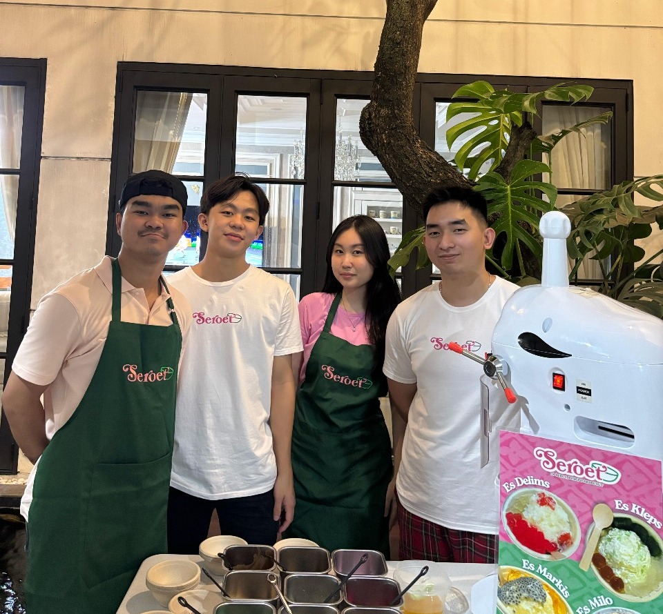 Seroet dessert stand with team members